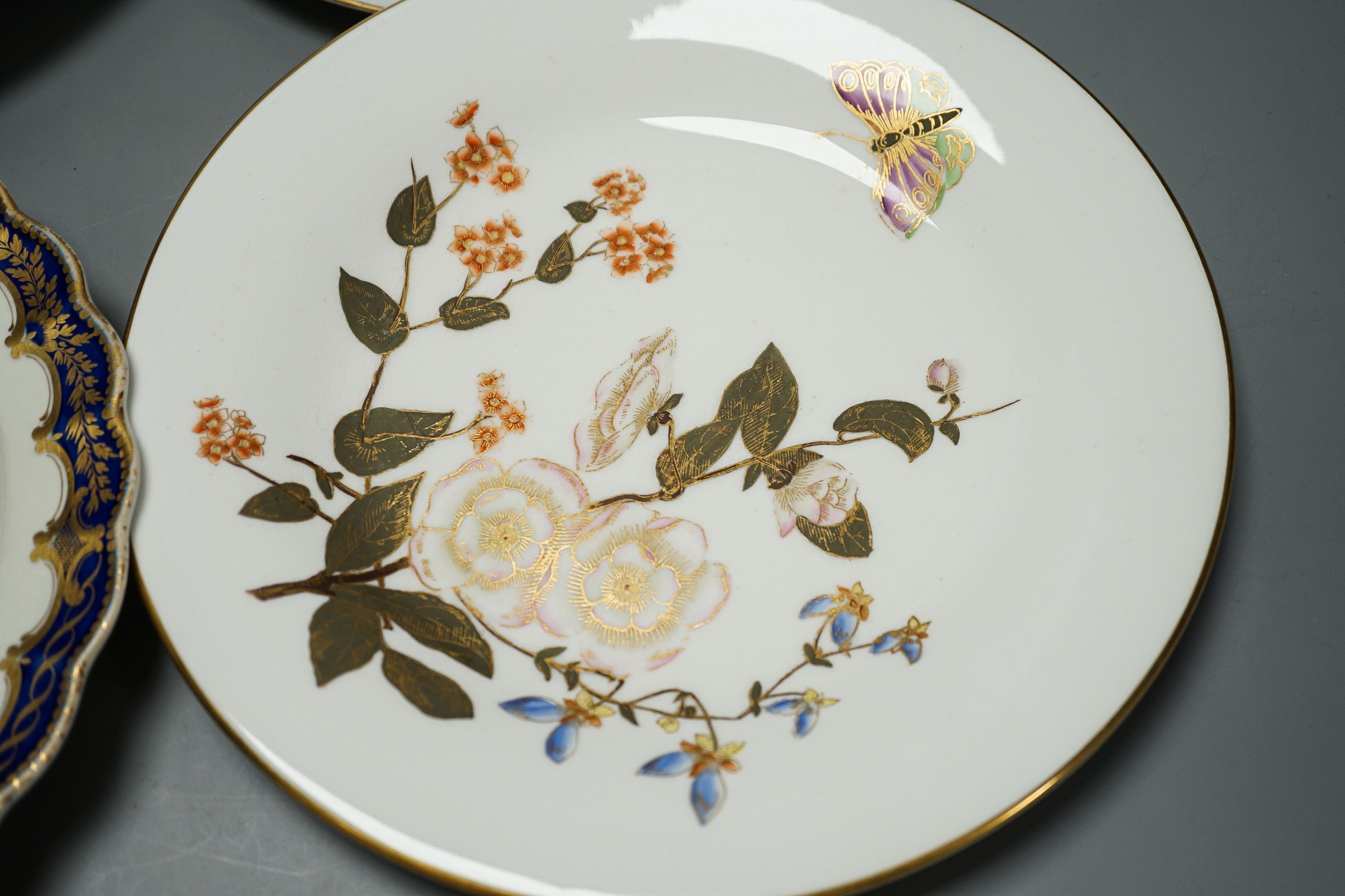 18th/19th century cabinet plates - A rare early Coalport landscape dessert plate, c.1805-10, a Coalport style plate, a Worcester blue and gilt foliate dish, c. 1790 and a pair of Royal Worcester dishes (5)